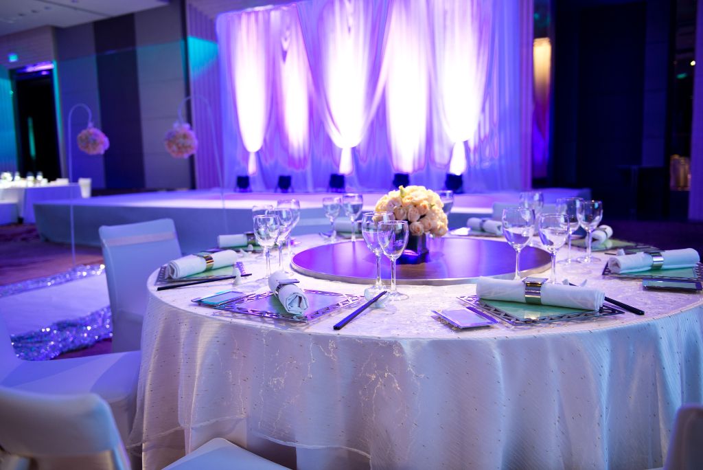 A table and custom lighting at a wedding reception