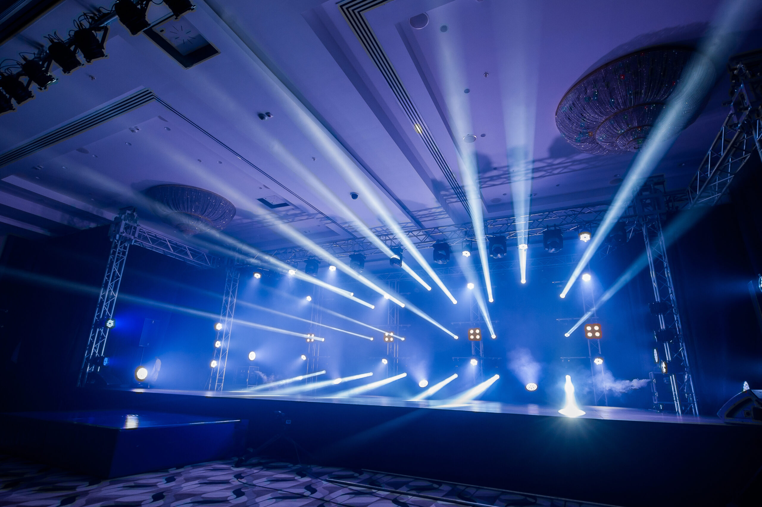 A stage with an impressive lighting show. AV staffing services.