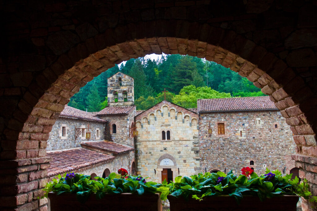 Framed View of Courtyard Walls Through Archway With Flowers at an Italian Style Castle in Napa Valley, Calistoga, California, USA