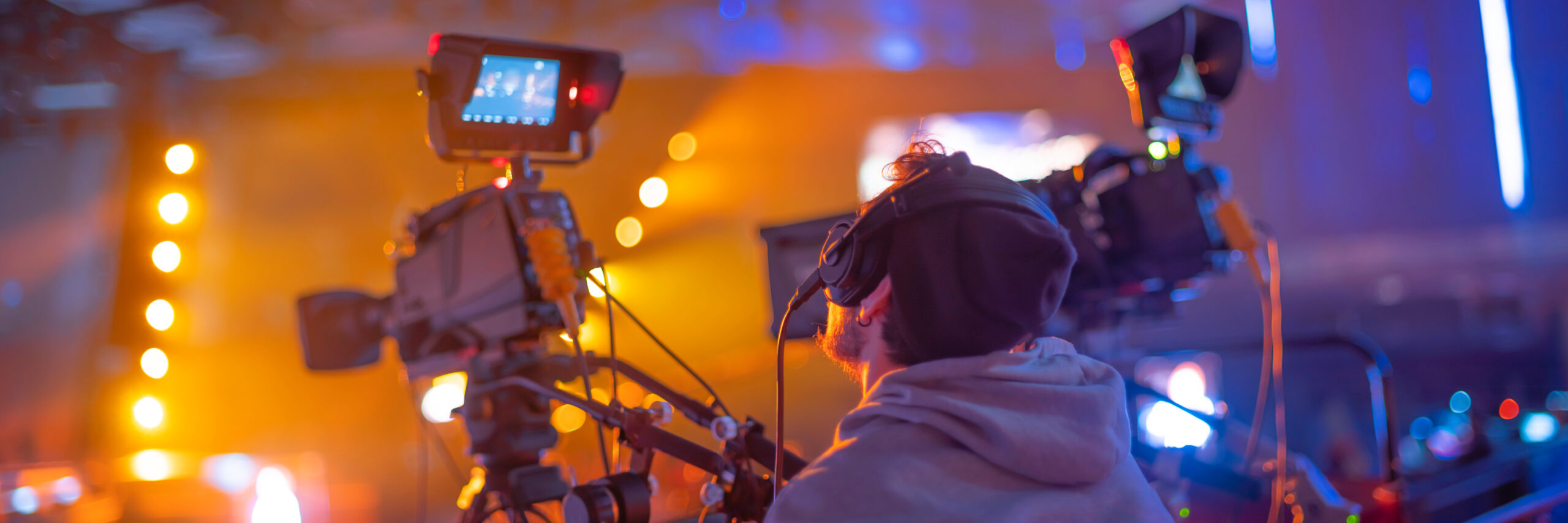 operator filming a concert for TV and the Internet