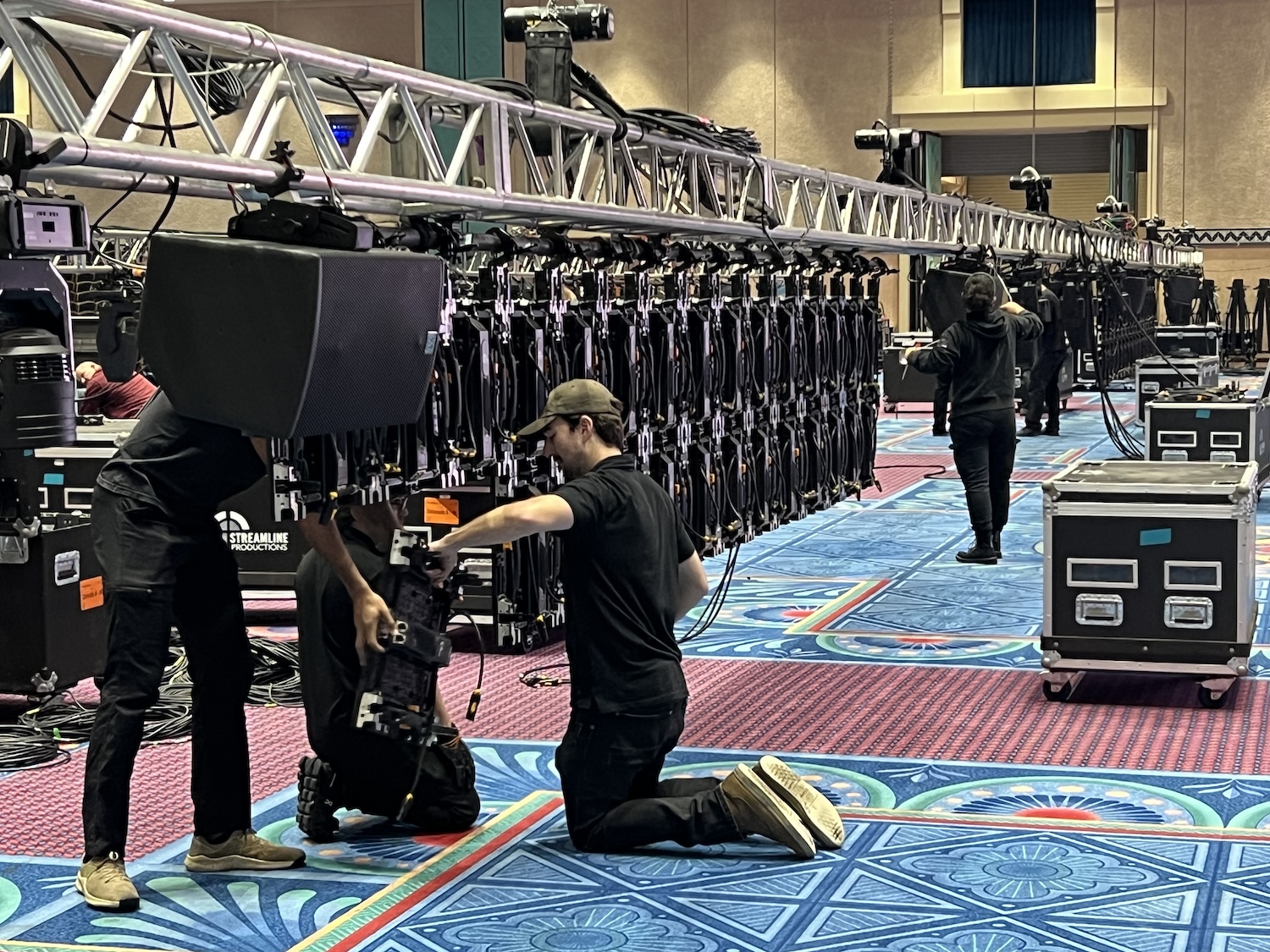 An Audio Visual Nation crew setting up speakers before an event