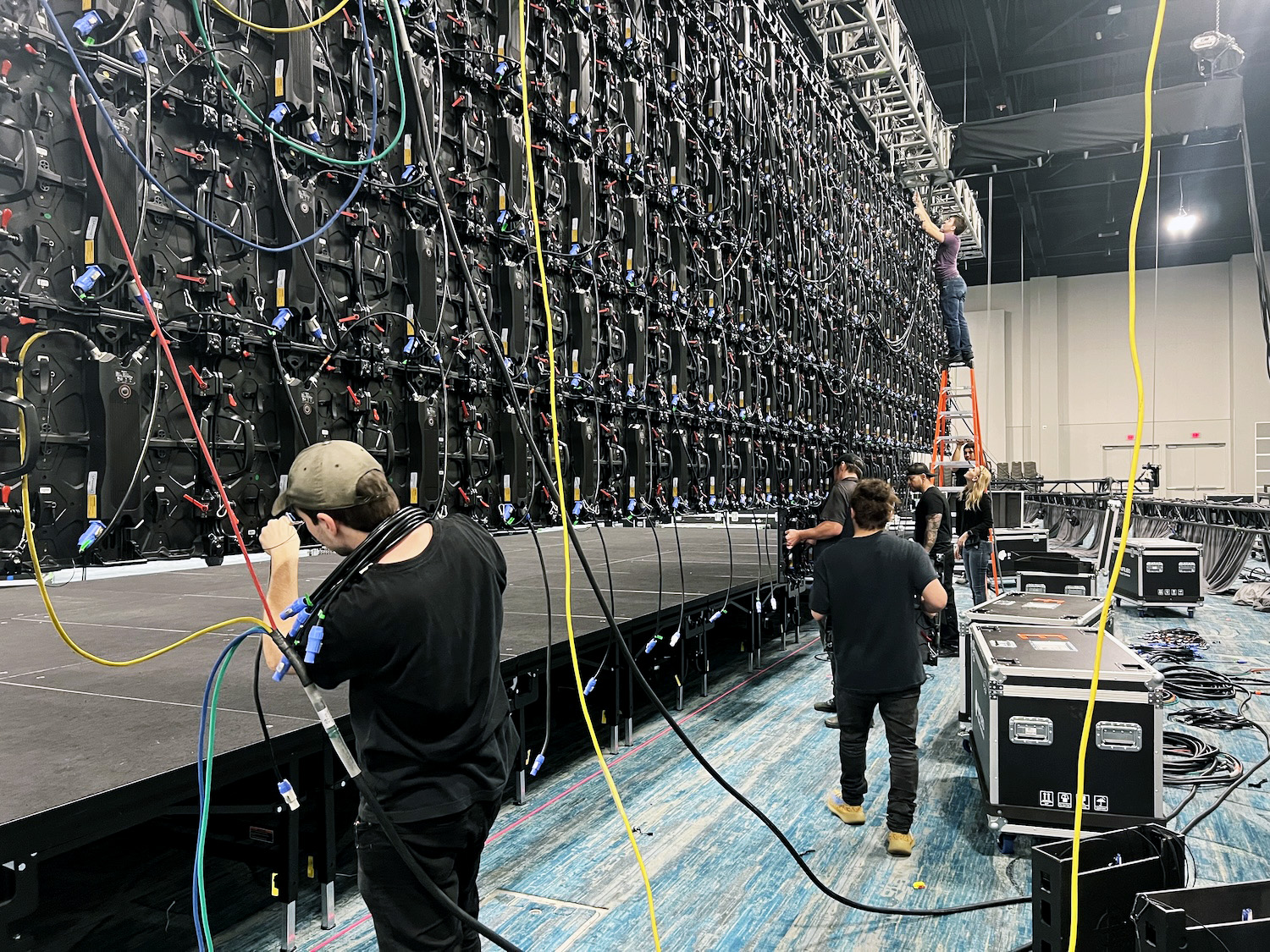 Audio Visual Nation technicians setting up an LED wall at an event