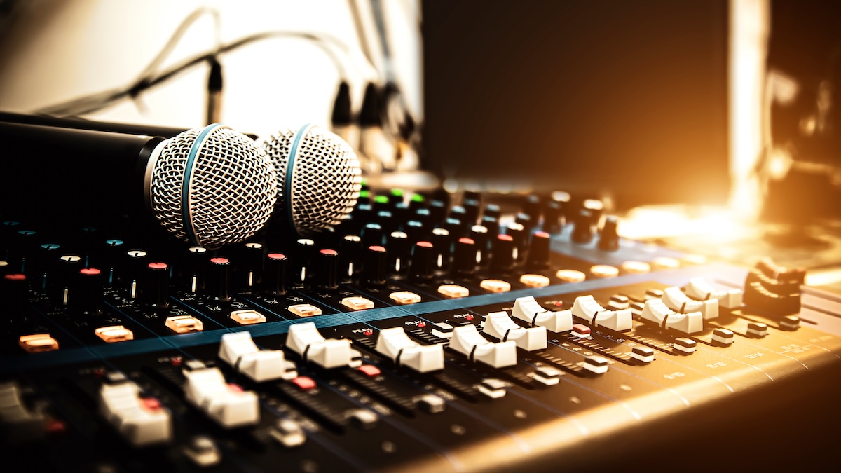 Closeup of microphones on a sound mixing board