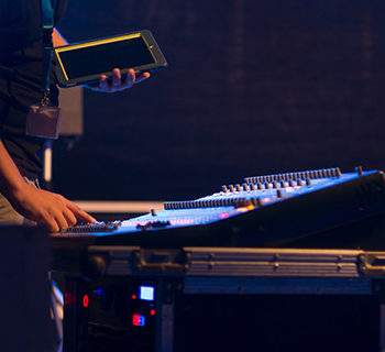 A Service Audio Engineer With iPad in Hand