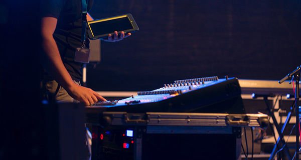 A Service Audio Engineer With iPad in Hand