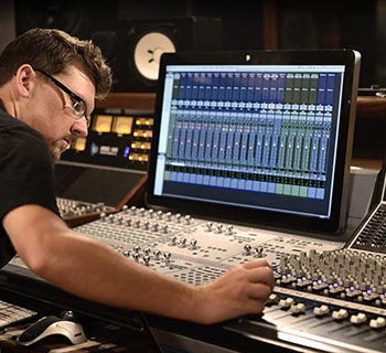 A Service Audio Engineer Working at his Audio Station