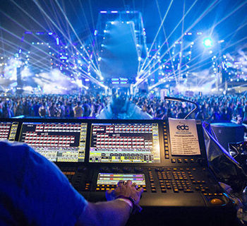 A Man in front of a Light and Music Control Unit. Audio visual staffing. Audio engineer. Orlando AV. Miami AV. Tampa events. AV staffing services. Audio visual services. Tampa events.