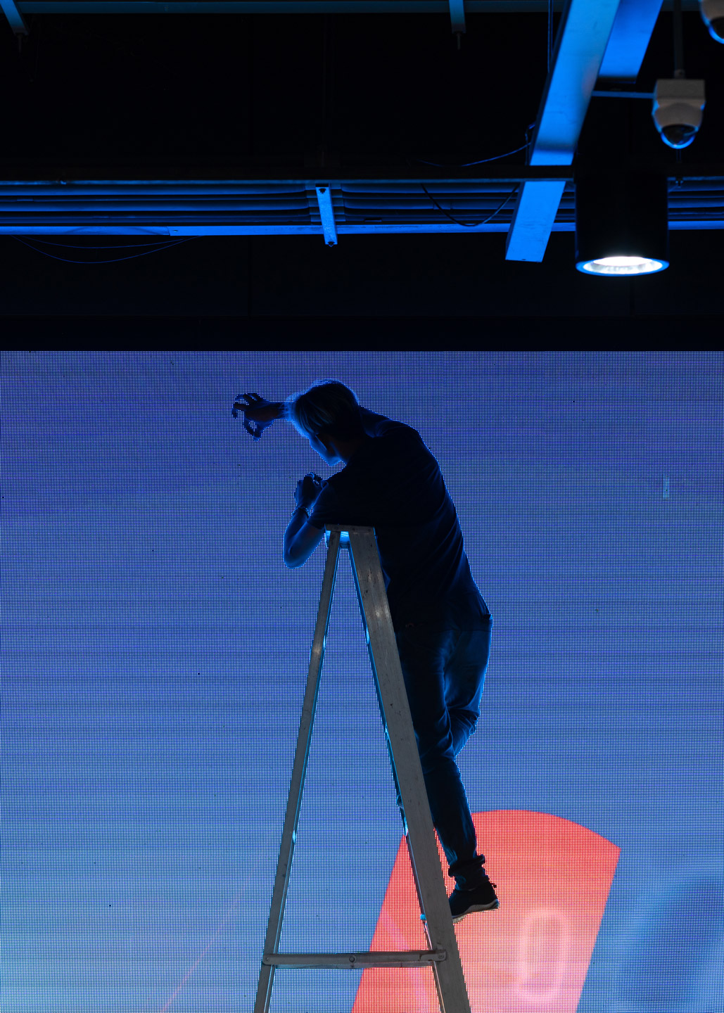 A technician working on an LED wall